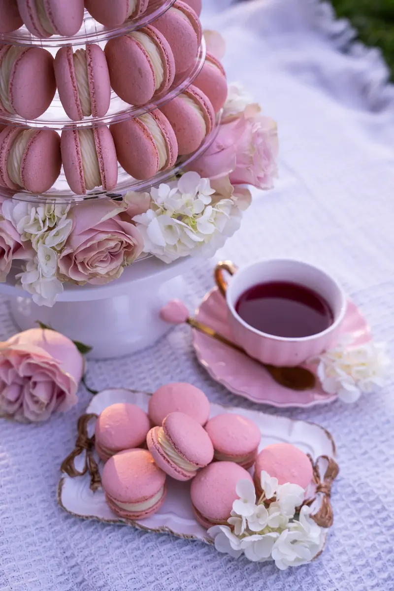 Pastel macarons beside a vintage telephone