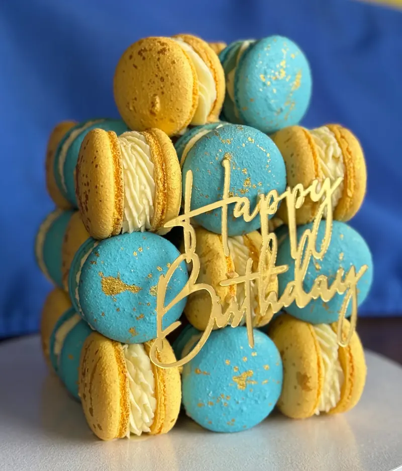 A cube cake built from rows of wholesale macarons